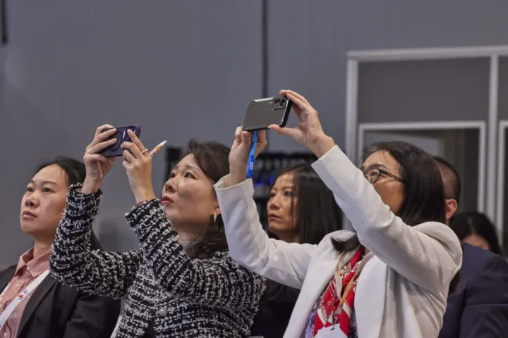 Participants photographing the stage