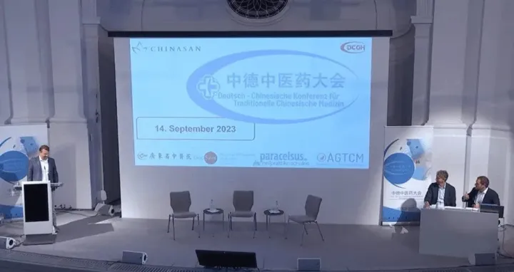 Stage of the TCM Conference on 14 September 2023 with lectern and panel