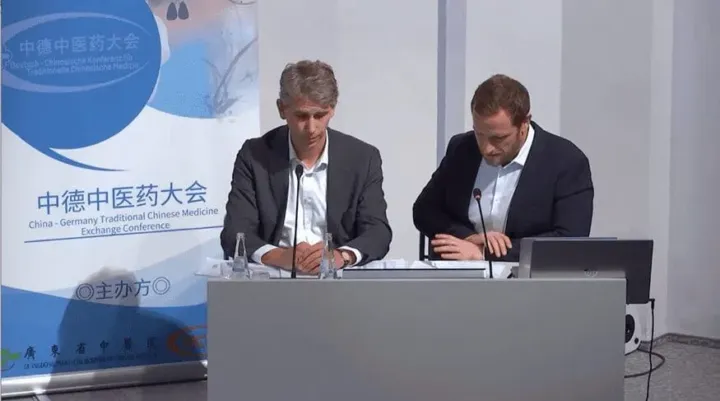 Two hosts at the panel table of the 2023 TCM Conference