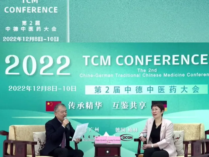 Title image of the 2nd TCM Conference 2022 with a studio discussion